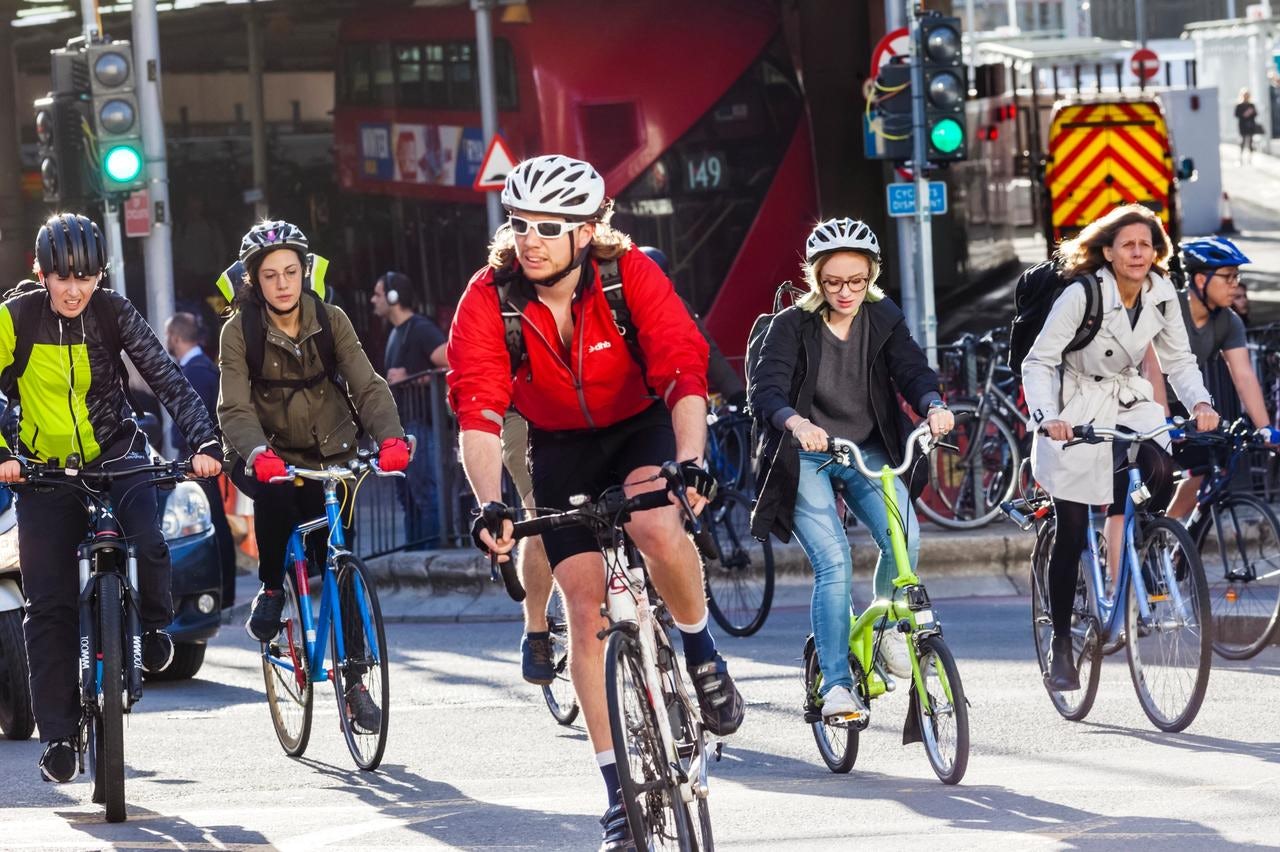 Commuters ride to work in London, the UK's most popular commuting city